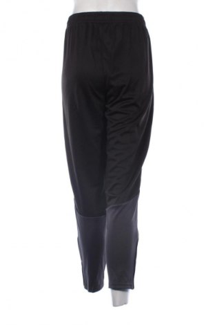 Γυναικείο αθλητικό παντελόνι PUMA, Μέγεθος L, Χρώμα Μαύρο, Τιμή 56,99 €