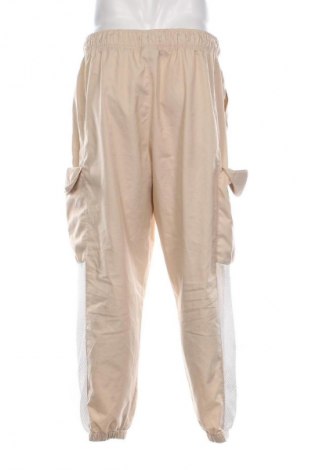 Męskie spodnie sportowe Air Jordan Nike, Rozmiar XL, Kolor Beżowy, Cena 187,55 zł