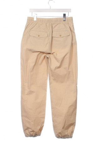 Gyerek nadrág Tommy Hilfiger, Méret 15-18y / 170-176 cm, Szín Bézs, Ár 25 209 Ft