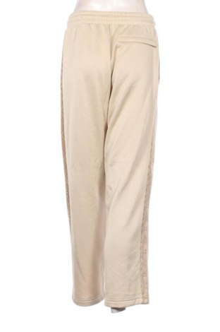 Γυναικείο αθλητικό παντελόνι PUMA, Μέγεθος S, Χρώμα  Μπέζ, Τιμή 21,99 €
