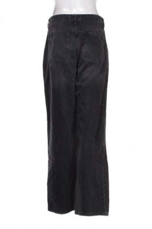 Damen Jeans Guido Maria Kretschmer for About You, Größe M, Farbe Schwarz, Preis 21,00 €