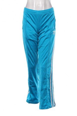 Damskie spodnie sportowe Adidas, Rozmiar M, Kolor Niebieski, Cena 89,99 zł