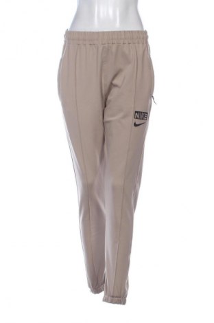 Дамско спортно долнище Nike, Размер M, Цвят Бежов, Цена 23,00 €