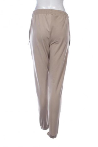 Дамско спортно долнище Nike, Размер M, Цвят Бежов, Цена 23,00 €