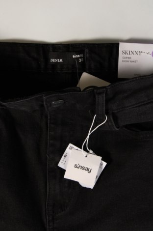 Damskie jeansy Sinsay, Rozmiar M, Kolor Czarny, Cena 70,99 zł