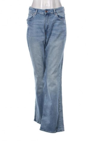 Damskie jeansy H&M, Rozmiar L, Kolor Niebieski, Cena 79,15 zł