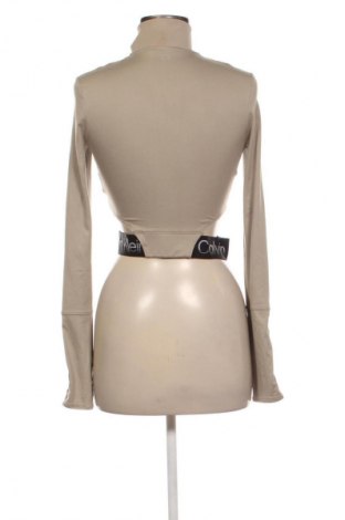 Γυναίκειο αθλητικό τοπ Calvin Klein, Μέγεθος S, Χρώμα  Μπέζ, Τιμή 19,99 €