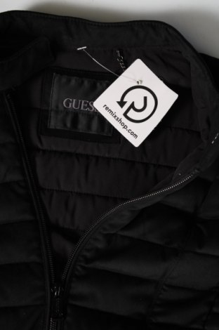 Γυναικείο μπουφάν Guess, Μέγεθος L, Χρώμα Μαύρο, Τιμή 119,59 €