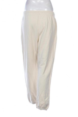 Дамско спортно долнище Uniqlo, Размер XL, Цвят Екрю, Цена 17,89 €