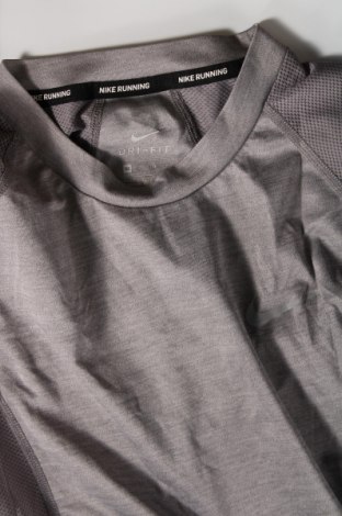 Γυναικεία αθλητική μπλούζα Nike, Μέγεθος XS, Χρώμα Γκρί, Τιμή 16,33 €