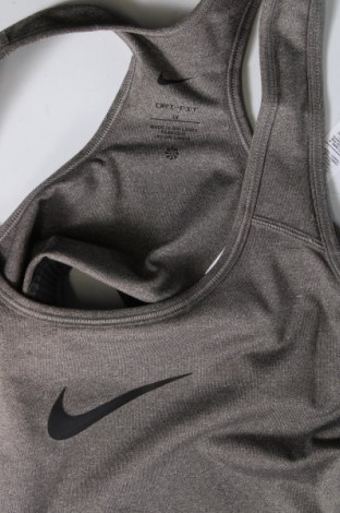Γυναίκειο αθλητικό τοπ Nike, Μέγεθος XL, Χρώμα Γκρί, Τιμή 15,59 €