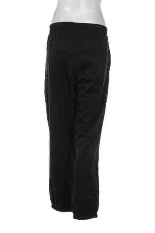 Γυναικείο αθλητικό παντελόνι PUMA, Μέγεθος L, Χρώμα Μαύρο, Τιμή 14,35 €