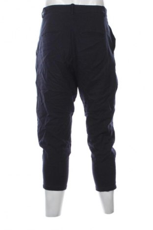 Męskie spodnie COS, Rozmiar M, Kolor Niebieski, Cena 385,33 zł