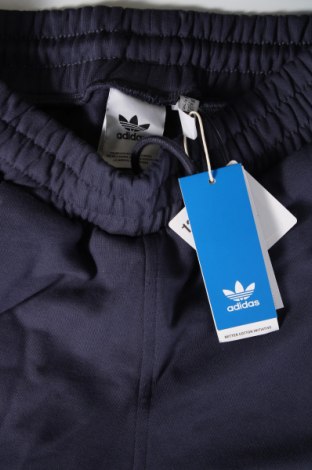 Męskie spodnie sportowe Adidas Originals, Rozmiar M, Kolor Niebieski, Cena 92,76 zł
