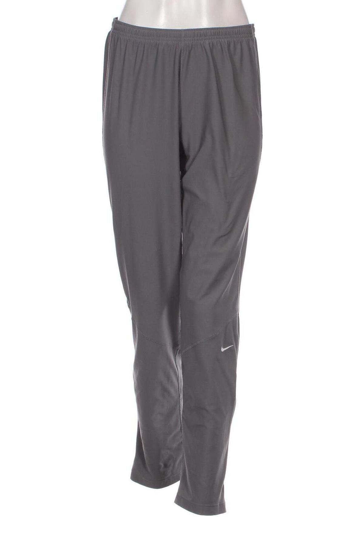 Γυναικείο αθλητικό παντελόνι Nike, Μέγεθος M, Χρώμα Γκρί, Τιμή 17,40 €