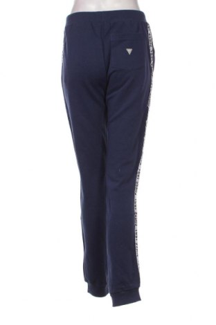Γυναικείο αθλητικό παντελόνι Guess, Μέγεθος L, Χρώμα Μπλέ, Τιμή 63,40 €