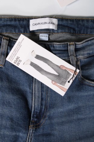 Męskie jeansy Calvin Klein Jeans, Rozmiar L, Kolor Niebieski, Cena 403,28 zł