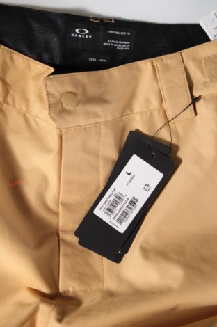 Męskie zimowe spodnie sportowe Oakley, Rozmiar L, Kolor Brązowy, Cena 329,85 zł