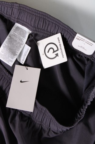 Męskie spodnie sportowe Nike, Rozmiar L, Kolor Niebieski, Cena 169,28 zł