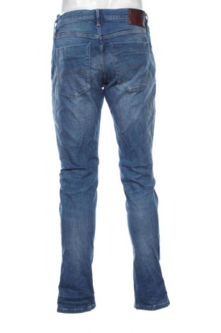 Męskie jeansy Tommy Jeans, Rozmiar M, Kolor Niebieski, Cena 245,99 zł
