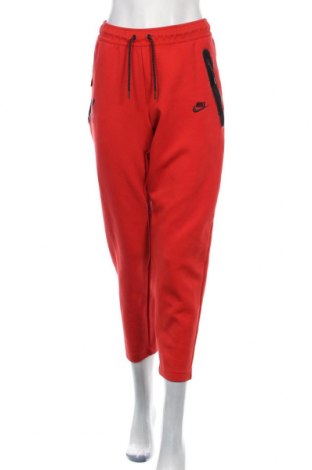 Γυναικείο αθλητικό παντελόνι Nike, Μέγεθος L, Χρώμα Πορτοκαλί, 66% βαμβάκι, 34% πολυεστέρας, Τιμή 32,16 €