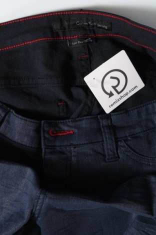 Damskie spodnie Calvin Klein Jeans, Rozmiar L, Kolor Niebieski, Cena 156,73 zł