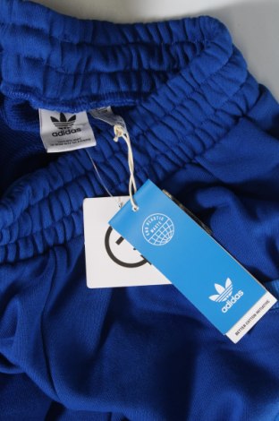 Damskie spodnie sportowe Adidas Originals, Rozmiar XS, Kolor Niebieski, Cena 125,22 zł