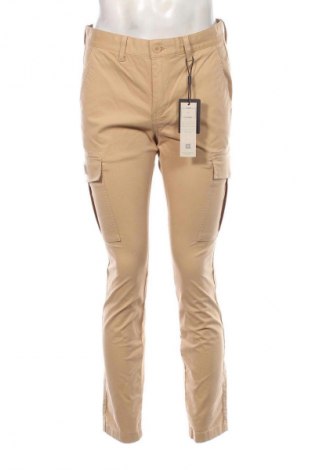Męskie spodnie Tommy Jeans, Rozmiar M, Kolor Beżowy, Cena 210,99 zł