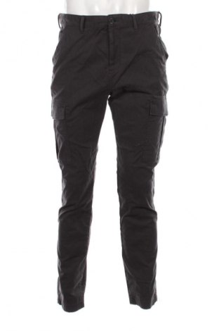 Pánské kalhoty  Tommy Jeans, Velikost L, Barva Šedá, Cena  919,00 Kč