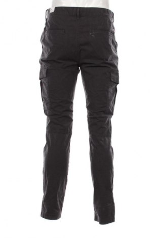Pánské kalhoty  Tommy Jeans, Velikost L, Barva Šedá, Cena  919,00 Kč