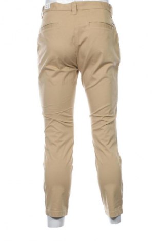 Męskie spodnie Tommy Jeans, Rozmiar S, Kolor Beżowy, Cena 423,99 zł