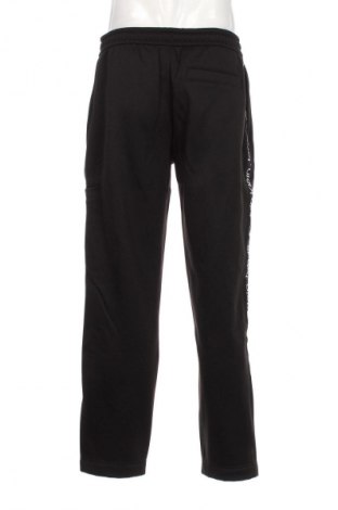 Pánské tepláky  Calvin Klein Jeans, Velikost L, Barva Černá, Cena  1 899,00 Kč