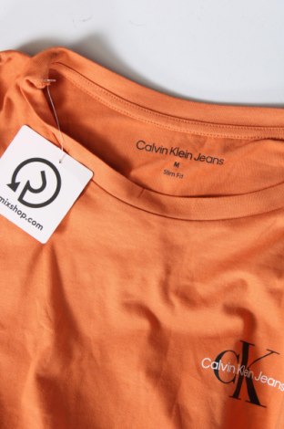 Γυναικείο t-shirt Calvin Klein Jeans, Μέγεθος M, Χρώμα Πορτοκαλί, Τιμή 27,84 €