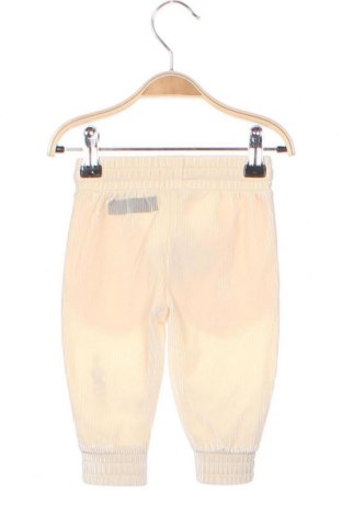 Dziecięce spodnie Guess, Rozmiar 3-6m/ 62-68 cm, Kolor ecru, Cena 110,11 zł