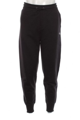 Pantaloni trening de bărbați Calvin Klein Jeans, Mărime M, Culoare Negru, Preț 269,74 Lei