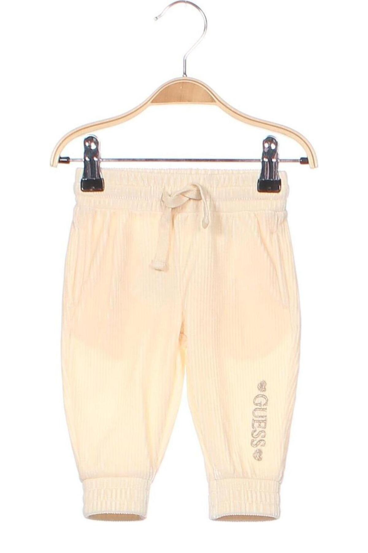 Dětské kalhoty  Guess, Velikost 3-6m/ 62-68 cm, Barva Krémová, Cena  599,00 Kč