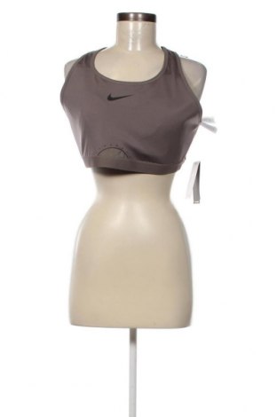 Γυναίκειο αθλητικό τοπ Nike, Μέγεθος XL, Χρώμα Γκρί, Τιμή 14,84 €