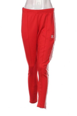 Damskie spodnie sportowe Adidas Originals, Rozmiar M, Kolor Czerwony, Cena 132,18 zł