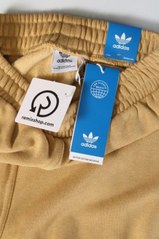 Damskie spodnie sportowe Adidas Originals, Rozmiar XXS, Kolor Beżowy, Cena 132,18 zł