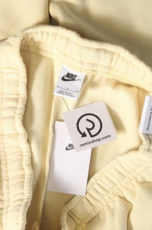 Γυναικείο αθλητικό παντελόνι Nike, Μέγεθος L, Χρώμα Κίτρινο, Τιμή 15,70 €