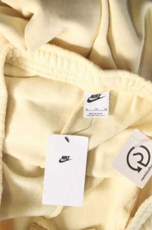 Γυναικείο αθλητικό παντελόνι Nike, Μέγεθος XL, Χρώμα Κίτρινο, Τιμή 15,70 €