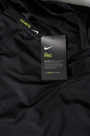 Γυναίκειο αθλητικό τοπ Nike, Μέγεθος XL, Χρώμα Μαύρο, Τιμή 15,88 €