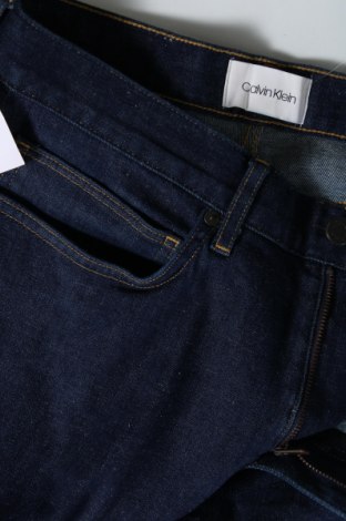 Męskie jeansy Calvin Klein, Rozmiar M, Kolor Niebieski, Cena 261,32 zł