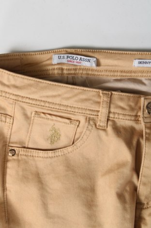 Damskie spodnie U.S. Polo Assn., Rozmiar S, Kolor Beżowy, Cena 96,66 zł