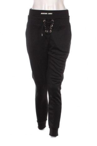 Γυναικείο αθλητικό παντελόνι Guess, Μέγεθος S, Χρώμα Μαύρο, Τιμή 85,02 €
