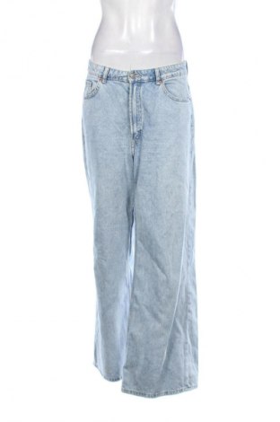 Damskie jeansy H&M Divided, Rozmiar L, Kolor Niebieski, Cena 66,69 zł