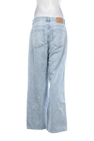 Damskie jeansy H&M Divided, Rozmiar L, Kolor Niebieski, Cena 66,69 zł