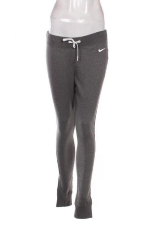 Damskie spodnie sportowe Nike, Rozmiar L, Kolor Szary, Cena 121,99 zł