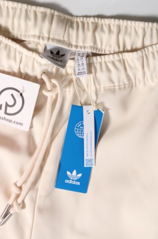 Damskie spodnie Adidas Originals, Rozmiar S, Kolor ecru, Cena 330,52 zł