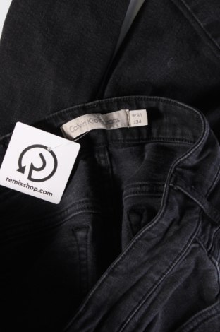 Męskie jeansy Calvin Klein Jeans, Rozmiar S, Kolor Czarny, Cena 142,34 zł